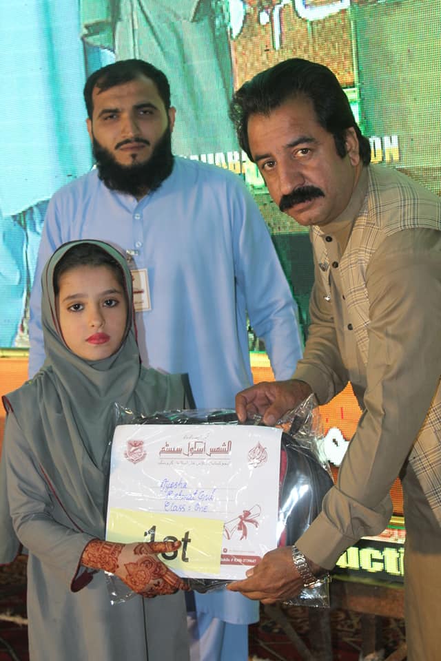 Person holding a green plant